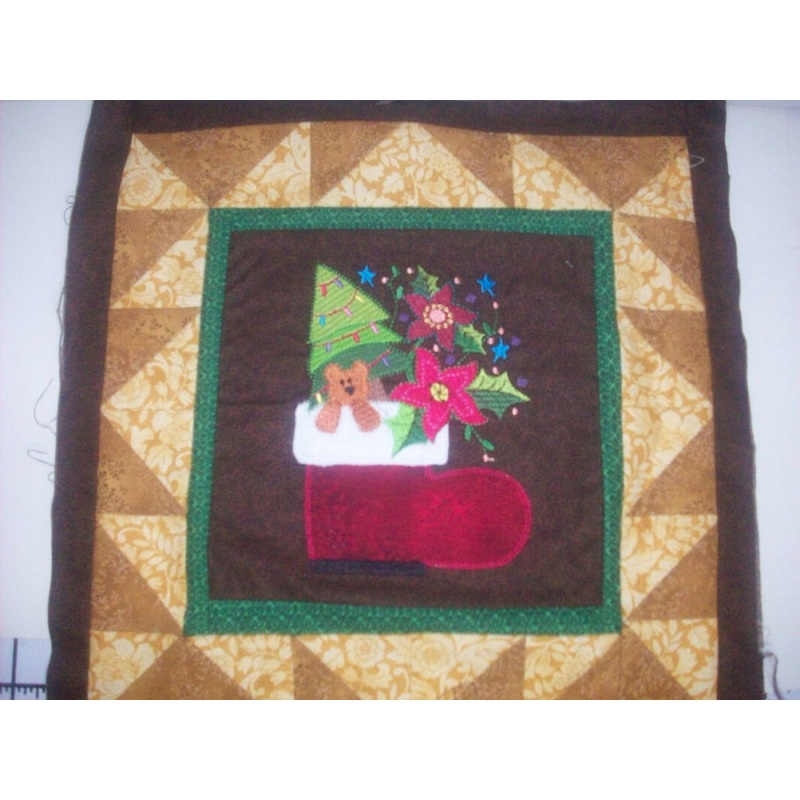 Christmas Stocking machine embroidered on center block in 14 inch quilt block - My wife's work