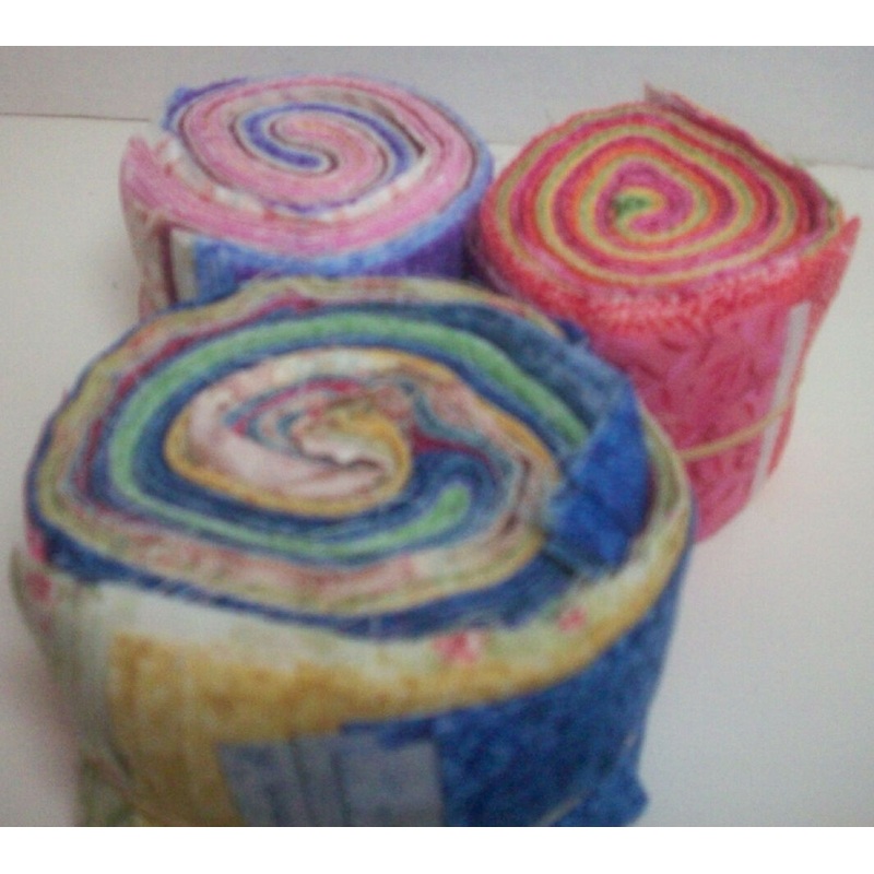 Three partial jelly rolls in bright colors