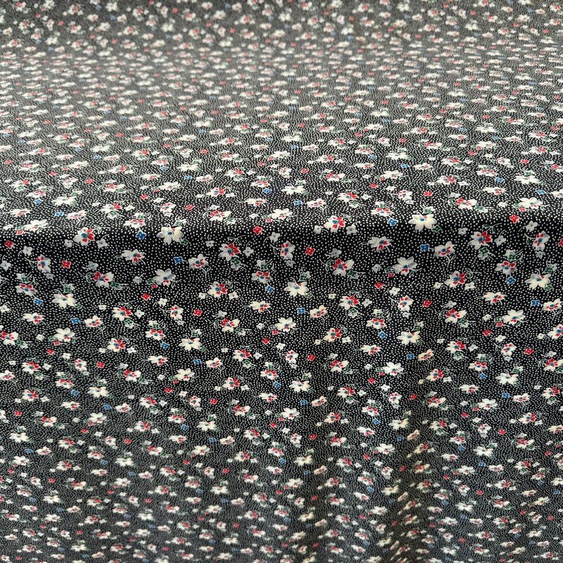 Black with Small White Dots and Floral Pattern Synthetic Knit - Yardage