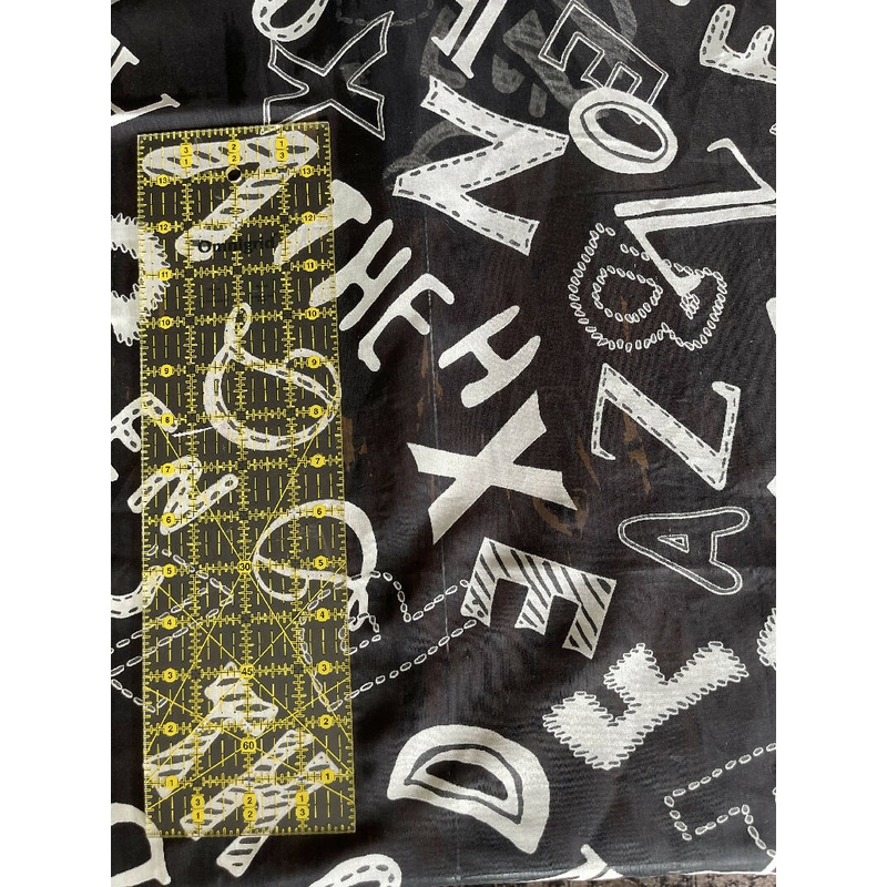Sheer alphabet print 1/2 yd
